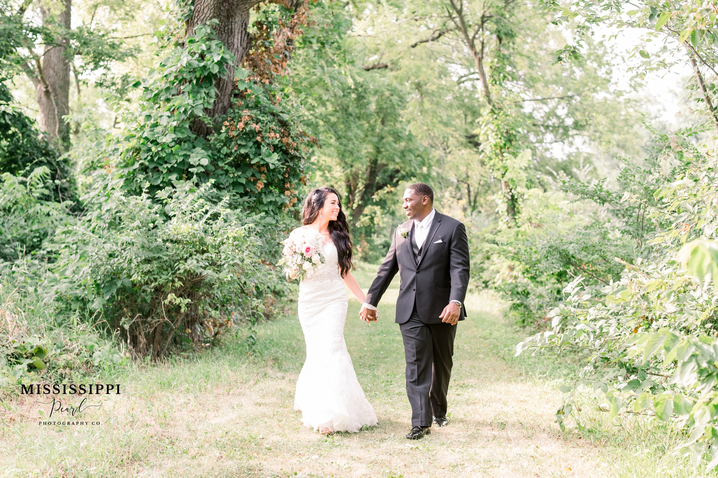Bride and Groom walking on path on the Hennepin Canal in Geneseo, Illinois